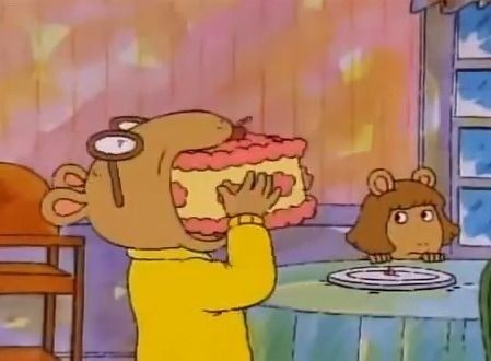 Arthur nomming a cake